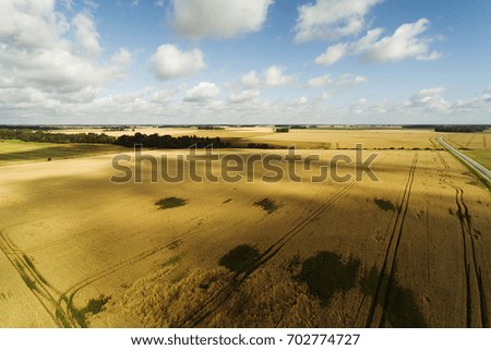 Similar – Sommer August Feld zur Erntezeit bei Sonnenuntergang Sonnenlicht