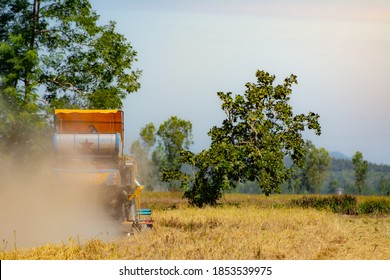 Agricultural Harvesters For Rice Harvesting Work From An Aerial Perspective In Thailand.