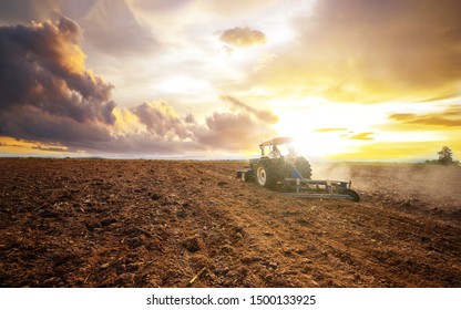 Agricultural industry tractors machinery tools plow large areas soil preparation and reducing labor costs.Agricultural analyst plan production food processing meet increasing consumption concept - Shutterstock ID 1500133925