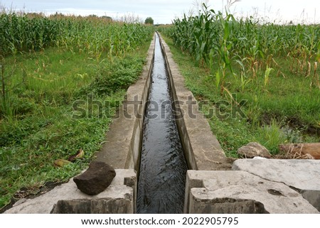 Agricultural irrigation channels are widely used to drain water from large rivers to fields or rice fields around the countryside of Bantul, Yogyakarta