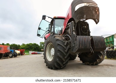 Agricultural Machinery Repair, Open Tractor Hood, Modern Engine, Tractor Maintenance.