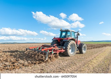 agricultural machinery working the land in the field