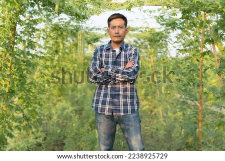 Similar – Portrait of a young man in the bamboo jungle