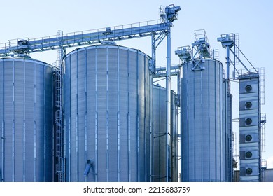 Agricultural Silos, Storage And Drying Of Grains, Wheat, Corn, Soy, Sunflower Against The Blue Sky Background, Grain Dryer