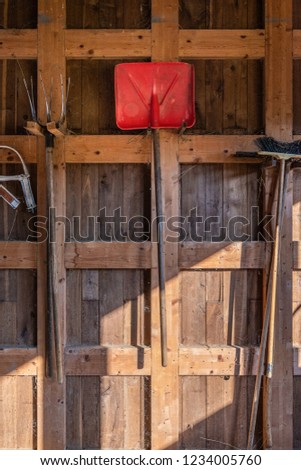 Agricultural Tools Hanging On Wooden Door Stock Photo Edit Now