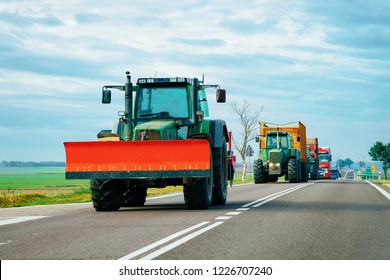 Agricultural tractor in the highway road, Poland. - Shutterstock ID 1226707240