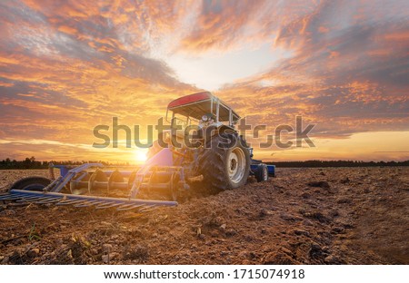 Agricultural tractors working cultivating preparing planting area, machinery, buoys, saving labor costs in the agricultural industry, agricultural tools, modern farming, smart farms, logistics technol