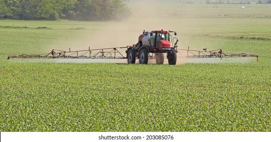 Agricultural Vehicle Spraying Chemicals On A Corn Field