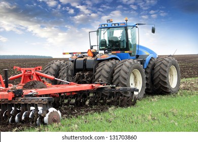 agricultural work plowing land on a powerful tractor