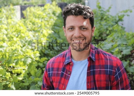 Agricultural worker posing with fields in the background