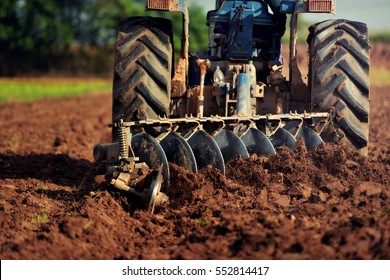Agricultural workers with tractors