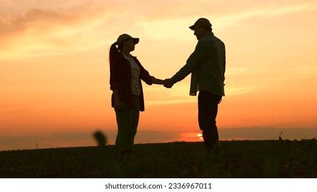 agriculture, agreement making deal handshake, work team team, business handshake silhouette, energetic grain analyzing ground, worker high cloudy support plant ecology summer coworkers, landscape - Powered by Shutterstock