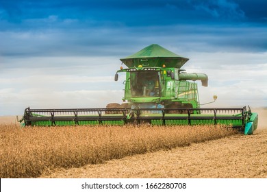 Agriculture - Correntina, Bahia, Brazil - April 27, 2019: Aerial Image Of Soybean Harvest, High Productivity, Machine Detail Harvesting Blue Sky - Agribusiness