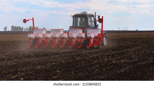 Agriculture Farm Tractor Seeding Machine Field Seeder Village Planter Rural Working Combine Tillage Plowing Agricultural Equipment Season Sowing Grain Spring time Process Planting Seeds  - Shutterstock ID 2153845825