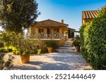 Agriculture farm in Tuscany near the town of Scansano during golden hour early September, Tuscany, Italy evokes relax and retreat from hustle to vacation in romantic destination