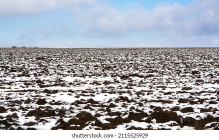 Agriculture. Field Of Chernozem Under The Snow.