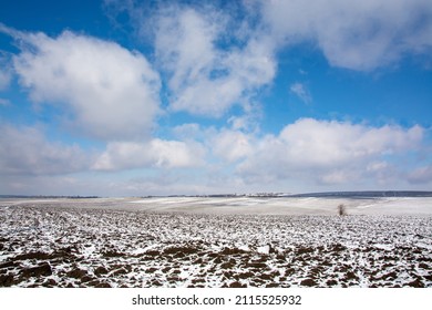 Agriculture. Field Of Chernozem Under The Snow.