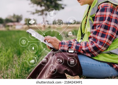 Agriculture technology farmer woman holding tablet or tablet technology to research about agriculture problems analysis data and visual icon. - Shutterstock ID 2184243491