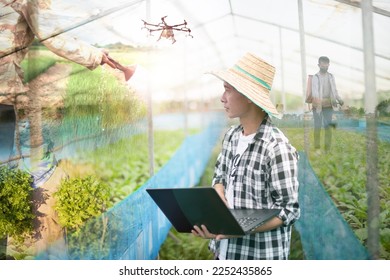 Agriculturists who use technology in a variety of comprehensive agriculture. - Shutterstock ID 2252435865