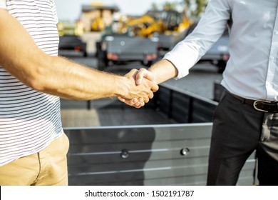 Agronomist Shaking Hand With Salesman, Buying A New Farm Truck Trailer At The Agricultural Shop, Close-up