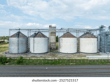 Agro-processing manufacturing plant for processing drying cleaning and storage of agricultural product, grain harvest. Modern silos. grain elevator facility. Large iron terminal of grain