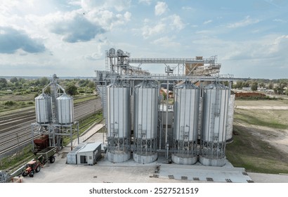 Agro-processing manufacturing plant for processing drying cleaning and storage of agricultural product, grain harvest. Modern silos. grain elevator facility. Large iron terminal of grain