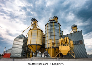 agro-processing plant for processing and silos for drying cleaning and storage of agricultural products, flour, cereals and grain with beautiful clouds