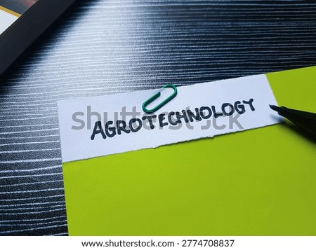 Agrotechnology writting on table background. 