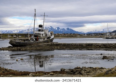 Aground ship on ushuaia sea coast