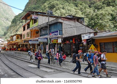 AGUAS CALIENTES, PERU - MAY 5 2010: Group Of Unidentified Tourists Arrives To Railways Station In Aguas Calientes After Hiking Tour 