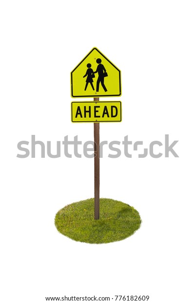 Ahead\
sign, people crossing, with pole and green\
lawn.