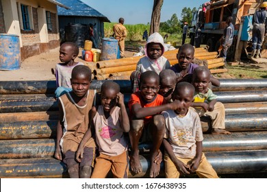 Ahero, Kenya - 25 June 2017: A group of boys pose onto of the pipes that are part of a clean water project for the local village and sponsored by a Southern Baptist Church