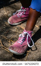 Ahero, Kenya - 26 June 2017: A Young Schoolgirl Displays Her Pink Tennis Shoes