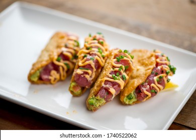 Ahi Tuna Tacos With Garlic Avocado Aioli, Scallions And Spicy Mayo Served In Crispy, Crunchy Taco Shells. Classic American Restaurant Appetizer Favorite.