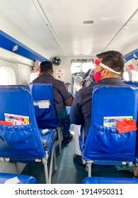 Ahmedabad, Gujarat, India- 20 January, 2021: Passengers Sitting Inside Seaplane With Mask And Face Shield. India's First Ever Sea Plane Service From Ahmedabad Riverfront To Kevadia Statue Of Unity.