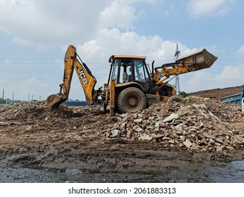 Ahmedabad, India - October 5 2021: JCB Digger Machine On Waste Material Site.