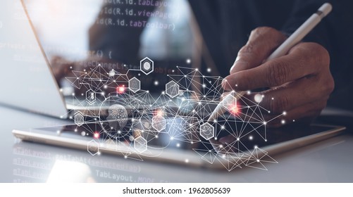 Ai, Artificial Intelligence, Digital technology, metaverse, software development, IoT Internet of Things concept. Software engineer using digital tablet, coding on laptop, javascript computer code - Powered by Shutterstock