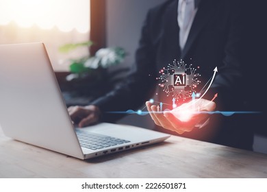 AI (Artificial intelligence) growing concept. Businessman hand typing keyboard laptop (notebook) with hologram technology. Business technology link digital marketing. Big data and Financial banking. - Shutterstock ID 2226501871