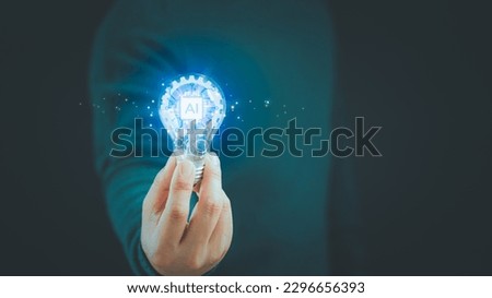Ai, artificial Intelligence, innovation and inspiration and create idea. Man hand holding illuminated light bulb. Inspiration concept of learning, new knowledge and sustainable business development.