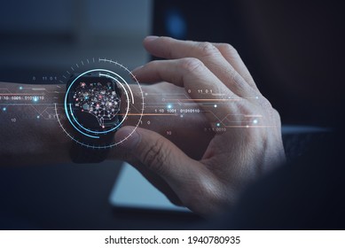 Ai Artificial Intelligence, IoT Internet of Things, digital software development. Futuristic technology innovation, Person using smartwatch with brain representing artificial intelligence interface - Powered by Shutterstock