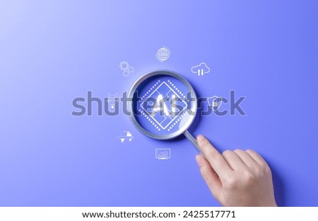 AI Artificial Intelligence technology concept. Hand holding magnifying glass focusing on AI chip on blue background. AI prompt generator, Machine learning, Marketing with chat robot, intelligent tech,