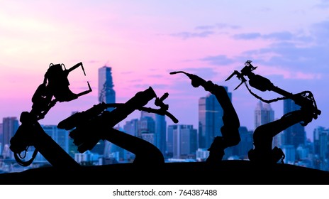 Ai Assistant Technology , Industry 4.0 , Artificial Intelligence Trend Concept. Silhouette Of Automation Robot Arms. Blur Metropolis City Building Background.