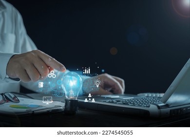 AI chatbot concept. Businessman touching light bulb, brain icon of artificial intelligence, Futuristic business Innovation that connects global networks. Smart Solutions, Chatbots, Technology Business - Powered by Shutterstock