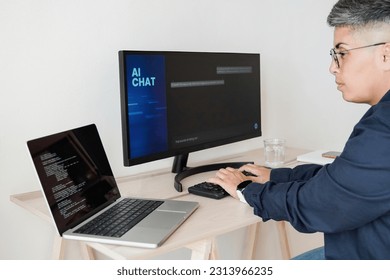 AI chatbot: Programmer using artificial intelligence for software development inside office - Virtual chat Bot technology trend - Focus on hands