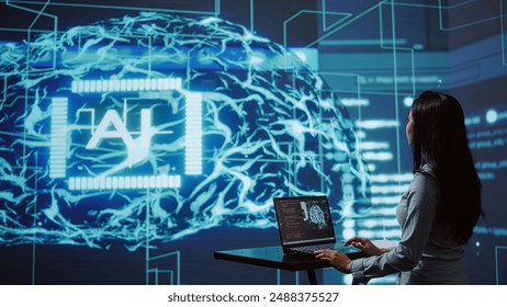 AI computer scientist using laptop for business data analysis in high tech workspace. Close up shot of Indian woman working on notebook to automatize tasks using artificial intelligence, camera B