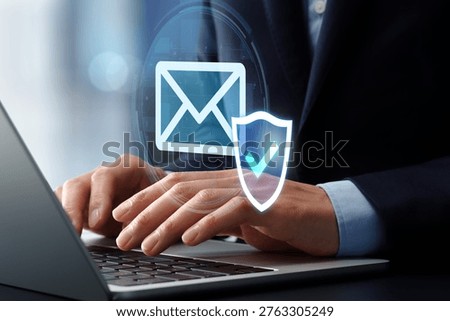 AI email security software. Secure mail filtering and protection systems. Shield and check mark icon. Businessman using laptop computer.