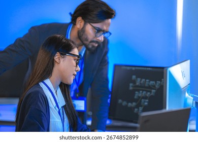 AI engineer developing algorithms in a futuristic data center. The blue light reflects innovation in machine learning, generative AI, blockchain, and modern cybersecurity.