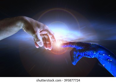 AI Hand Reaches Towards A Human Hand As A Spark Of Understanding Technology Reaches Across To Humanity. Artificial Intelligence Concept Copy Space Area. Blue Cyborg Arm And Flare Science Background