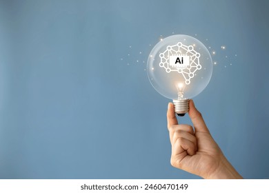 AI, Machine learning, Hand holding light bulb with virtual Artificial Intelligence and virtual digital brain. AI Technology.Science and artificial intelligence technology, innovation for futuristic. - Powered by Shutterstock