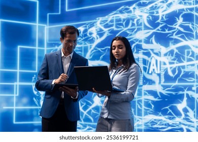 AI researcher and colleague working with artificial intelligence neural networks modern lab. Computer scientists collaborating on developing AI system in high tech workplace